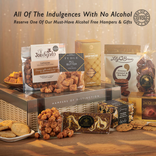 The blog cover to the alcohol free hampers & gifts page at Spicers of Hythe. The image depicts an opened hamper bursting with chocolate, shortbread & more non-alcoholic treats